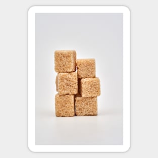 Closeup of brown sugar cubes on white Sticker